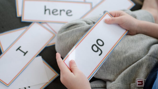 A child playing with flashcards