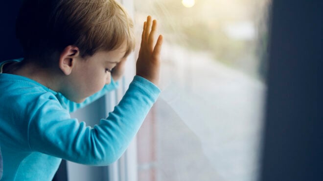 boy looking out window