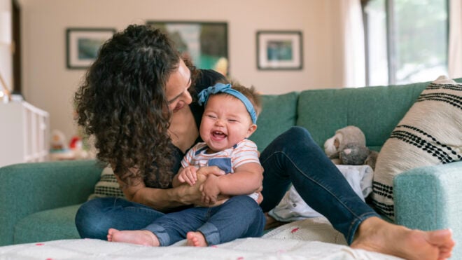 mom playing with baby