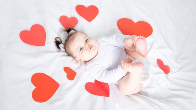 baby with red hearts, valentine's day concept