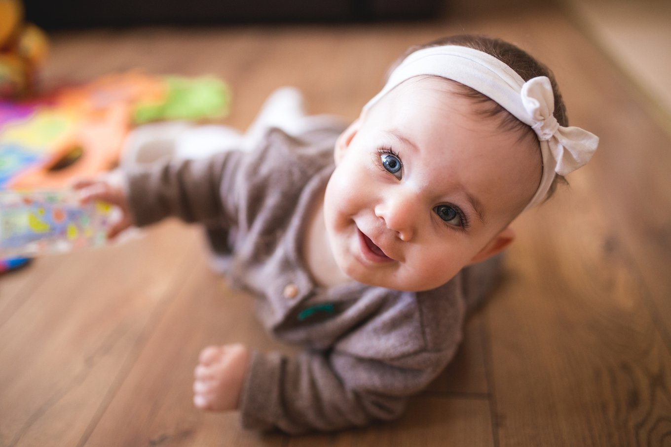 Cute Baby Girl Crawling In Living Room