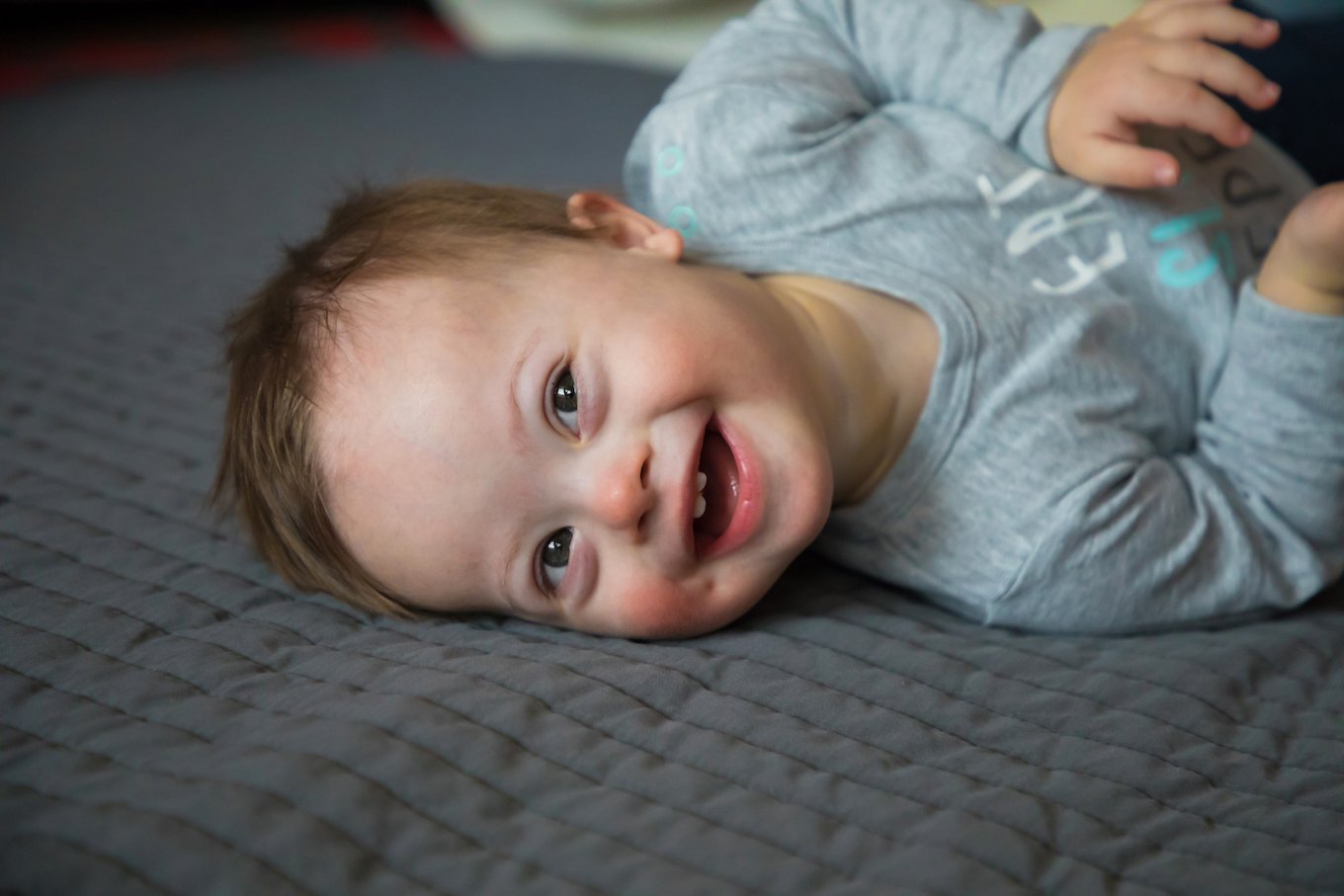 Portrait of cute baby boy with Down syndrome