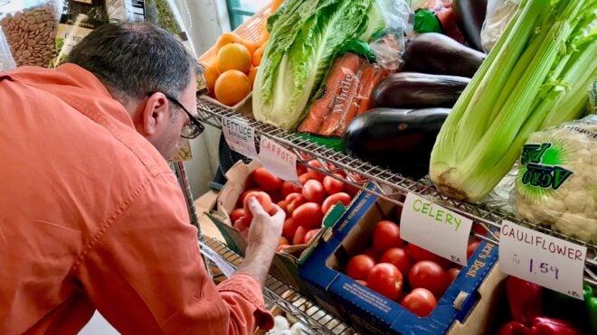 Man picking out vegetables